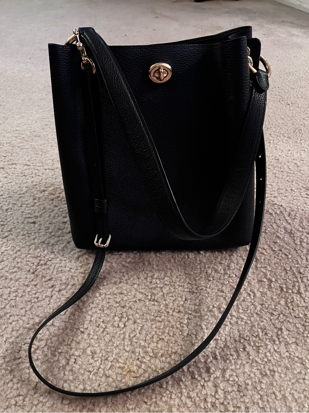 Coach 100% authentic black leather bucket bag with gold hardware.